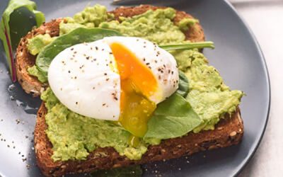 Avocado and poached egg on rye bread toast